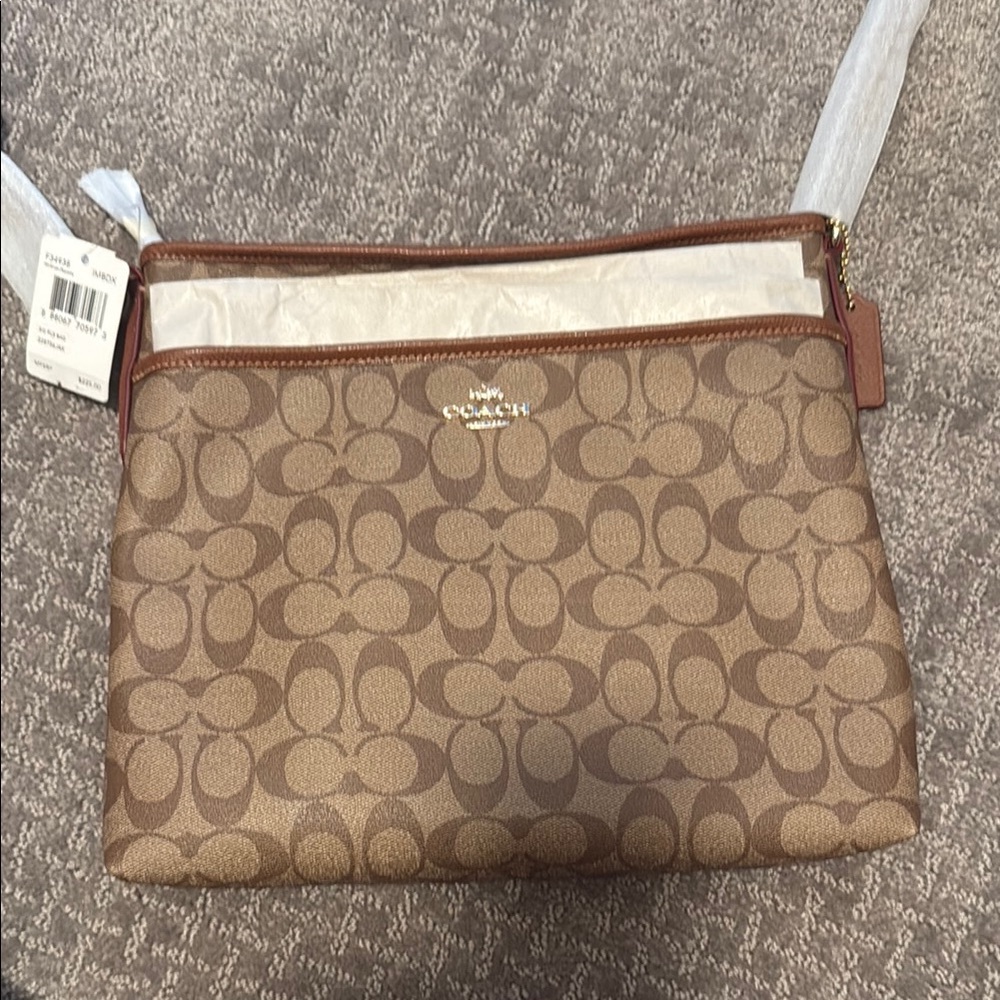 Coach Brown Monogram Clutch with Leather Strap